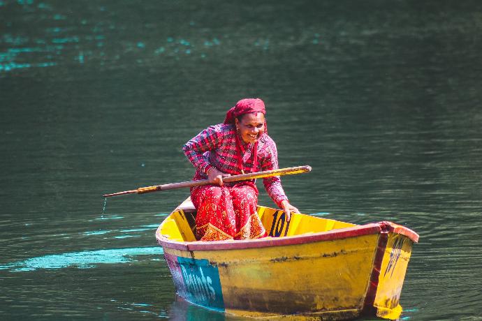 smiling woman on canoe